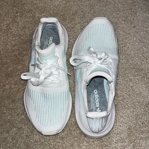 White and light bluish/green adidas sneakers